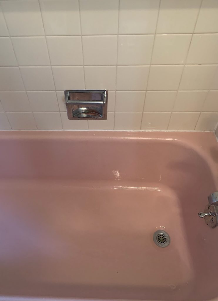 Same pink bathtub after cleaning